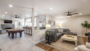 A spacious living area with a pool table, a grey sofa, and a coffee table. - Scottsdale Kierland Oasis: Heated Pool, Golf & More (Scottsdale)
