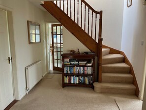 A staircase with a wooden handrail leading to a landing. - Lonsdale - a house that sleeps 6 guests in 3 bedrooms (Dalbeattie)