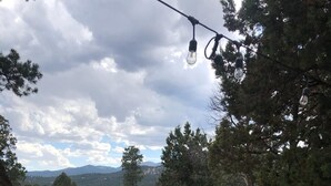 A hot tub with a view of a mountainous landscape. - Pet-Friendly [no fee!] A-Frame Cabin w/ Double-decker Mountain View & Hot Tub (Alto)