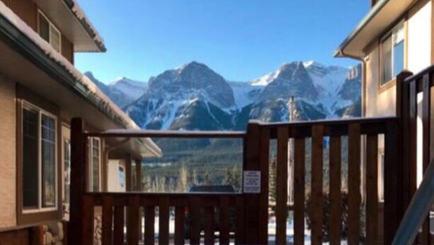 A pool with a view of mountains.