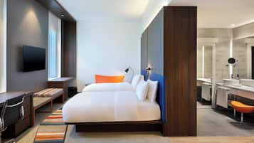 Hypo-allergenic bedding, down comforters, minibar, in-room safe