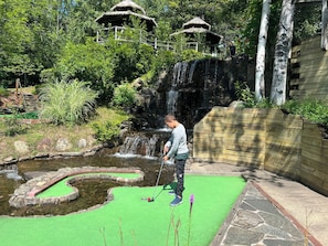 Play a round of golf amidst lush surroundings and scenic water features.