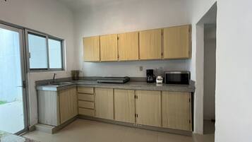 Microwave, blender, cookware/dishes/utensils