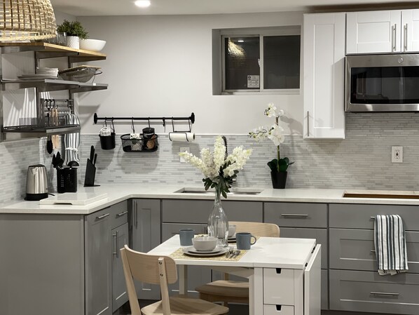 Microwave, stovetop, coffee/tea maker, cookware/dishes/utensils