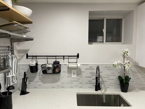 Microwave, stovetop, coffee/tea maker, cookware/dishes/utensils