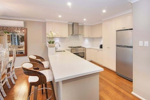 Coffee/tea maker, fridge, microwave, oven