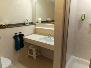 Shower, hair dryer, towels, toilet paper
