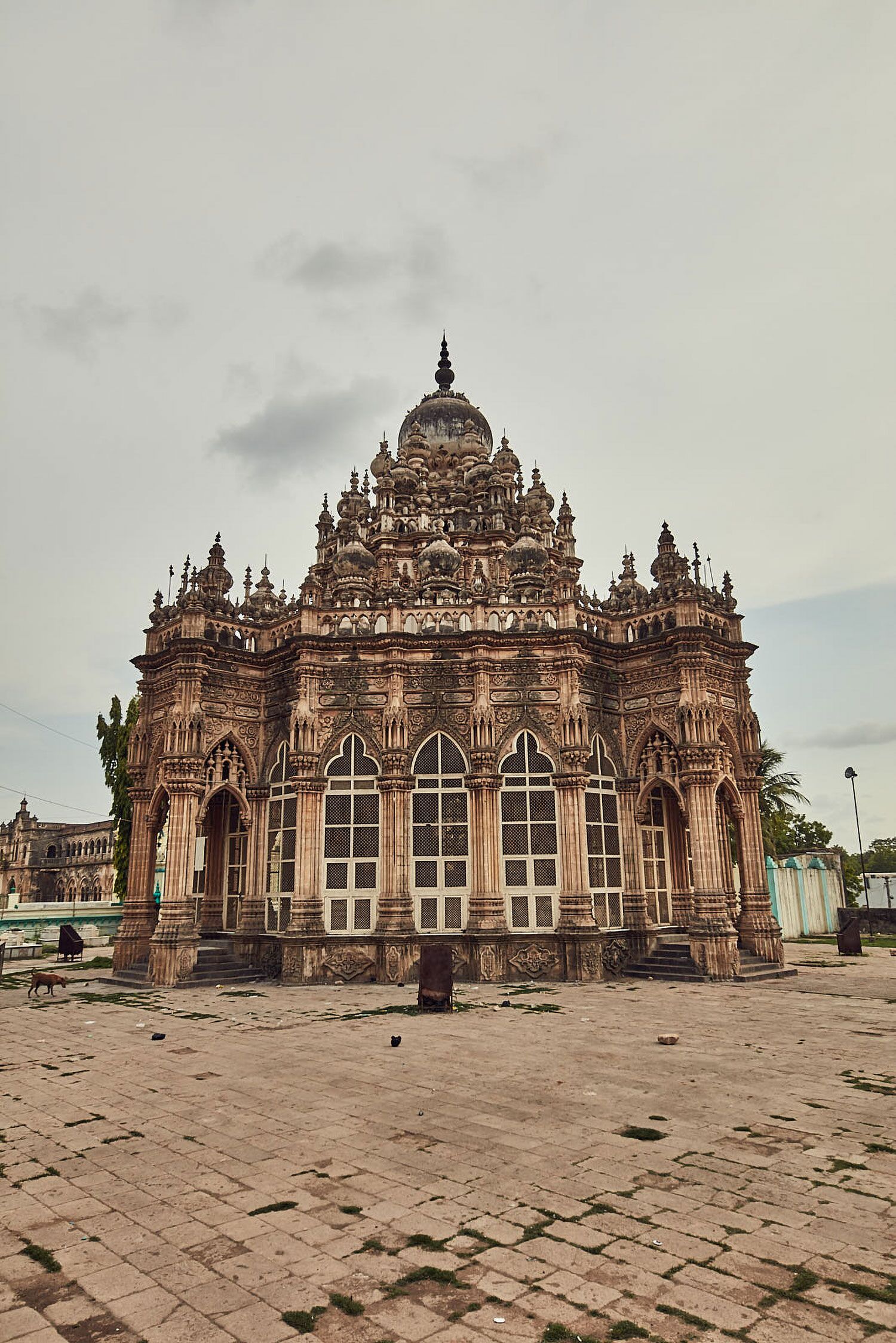 A large, ornate building with intricate carvings and multiple domes.