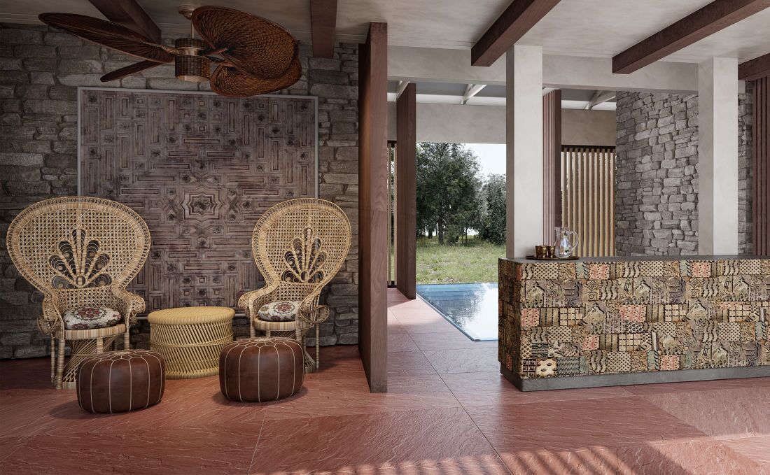 A modern interior with wicker furniture, a stone wall, and a view of the outdoors.