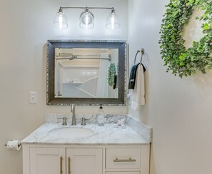 Shower, rainfall showerhead, hair dryer, towels