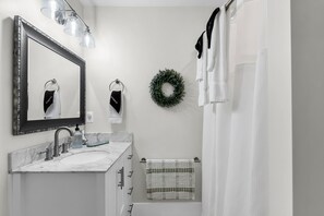 Shower, rainfall showerhead, hair dryer, towels