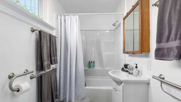 Bathtub, hair dryer, towels