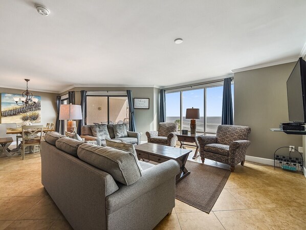 Flat-screen TV, DVD player, smart speakers