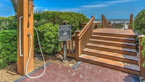 A staircase leading to a beach area with a sign about sea turtle nesting season. - 3BR Villa w/ Just a 2 Minute Walk from Beach (Hilton Head Island)
