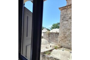 Enjoy the serene view of the surrounding landscape from this room's window.