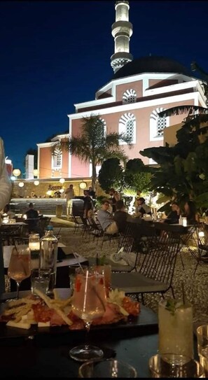 Enjoy a meal with a view of the city's iconic landmark from our outdoor dining area.