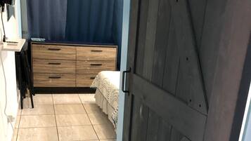 1 bedroom, desk, iron/ironing board, travel cot