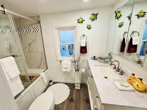 Bathtub, hair dryer, towels, soap