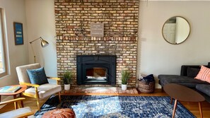 Smart TV, fireplace, books