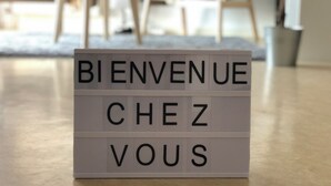 A welcome sign in a hotel lobby.