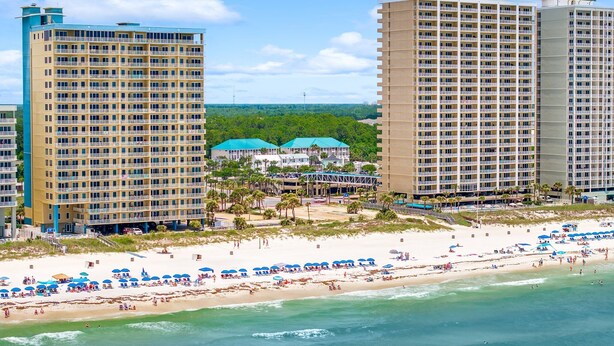 A beachfront hotel with multiple floors, a sandy beach, and a clear view of the ocean. - Unwind Your Mind...5 BR,4.5 baths...Book now for Summer (Panama City Beach)