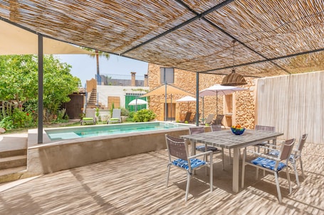 Outdoor dining. SA TEULERA DE PINA - Modern village house with beautiful private pool in the center of Mal