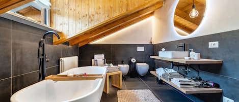 Bathtub, hair dryer, towels