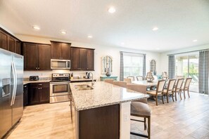 Fridge, microwave, oven, stovetop - Traditional Home with Private Pool and Spillover Spa at Encore (Kissimmee)