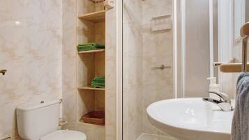 Bathtub, hair dryer, towels
