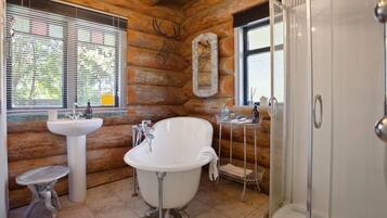 Combined shower/bathtub, towels, soap, toilet paper