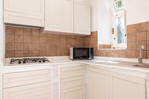 Fridge, microwave, electric kettle, cookware/dishes/utensils