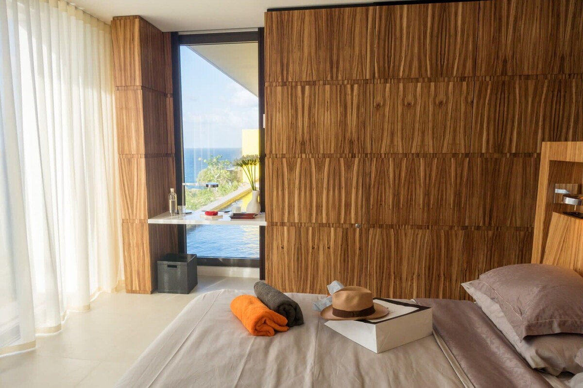 Master suite with king bed facing the sea