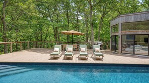 A heated pool, pool loungers - Contemporary and serene estate with heated saltwater pool, expansive... (East Hampton)