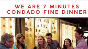 A group of people in a dining area with a sign indicating 'WE ARE 7 MINUTES CONDADO FINE DINNER'. - Pool - Water tank -Solar panels  5 Min AiRpOrT & Isla Verde Beach! Watch Video - (Carolina)