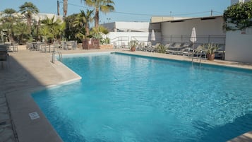Seasonal outdoor pool, pool loungers