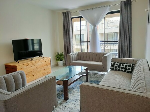 Apartamento | Zona de estar | Una televisión de pantalla plana