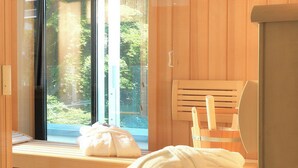 A sauna room with wooden benches and a large window. - Beach Cloud Luxury Apartment: Private Sauna, Pool, and Beach Chair | Terrace | Fireplace (Binz)