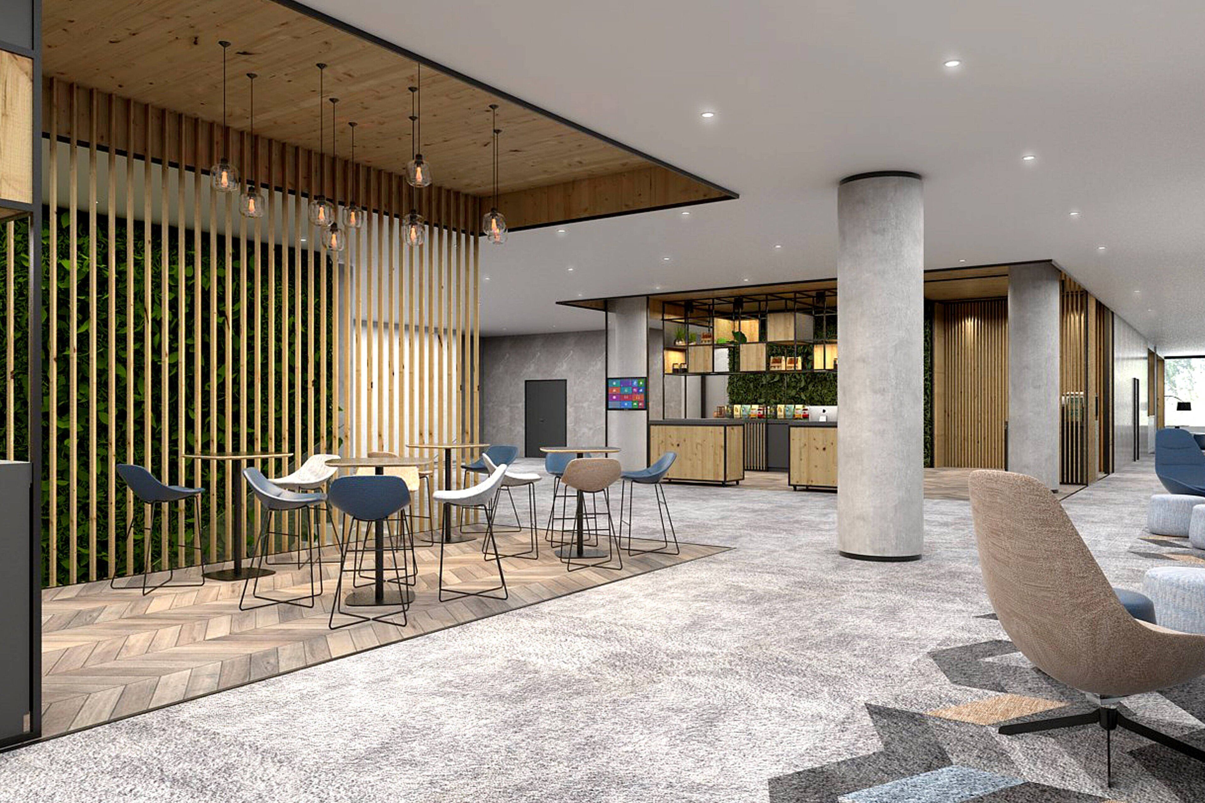 A modern interior with a seating area, a bar, and a reception desk.
