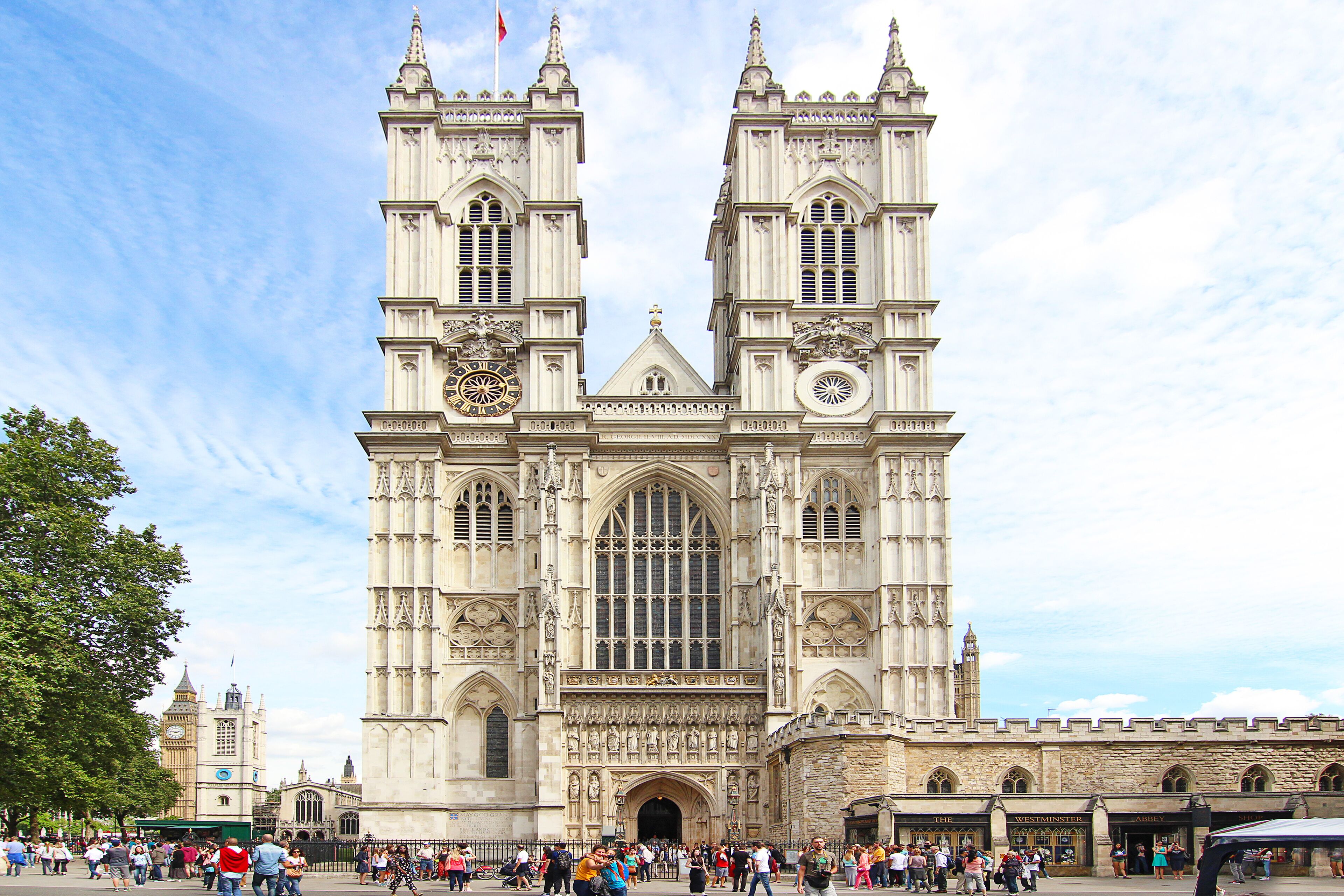 A historic cathedral with twin towers and large stained glass windows.