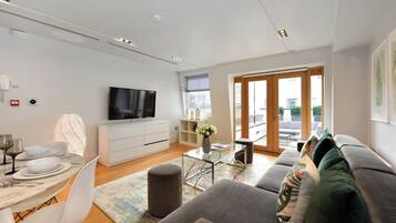 Superior Apartment | Living area | 49-inch Smart TV with satellite channels, TV, Netflix