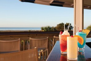 Enjoy a meal with a view of the ocean in this outdoor dining area.