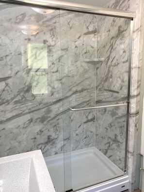 Shower, towels, soap, toilet paper