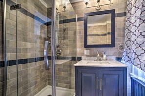 Bathtub, hair dryer, towels, soap