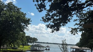 A lakeside property with a gazebo, dock, and small house. - Fisherman’s Getaway with Sunset Views & Room for 11 (Jewett)