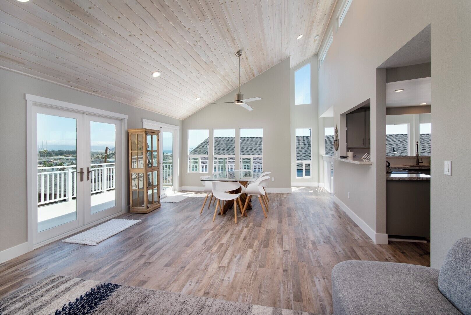 The dining room has direct access to the large deck, with ocean and rock views