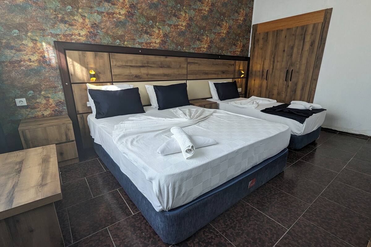 Standard Triple Room | Desk, laptop workspace, WiFi (free), bed sheets