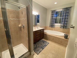 Combined shower/tub, hair dryer, towels, soap