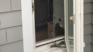 A partially open door to a room with a visible window, a door handle, and a small step leading into the room. - West Harwich- Cozy Cape House walking distance to Dennis Port & Bell's Neck path (Harwich)