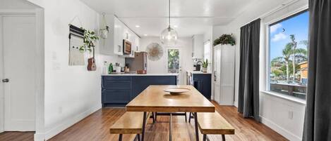 Open spacious kitchen full stocked for cooking meals.