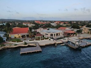 A coastal property with a dock, a gazebo, and a building with a red roof. - Rest, Work and fun in the Caribbean (Oranjestad)